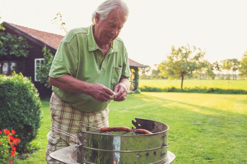 Old man preparing for his Barbeque party